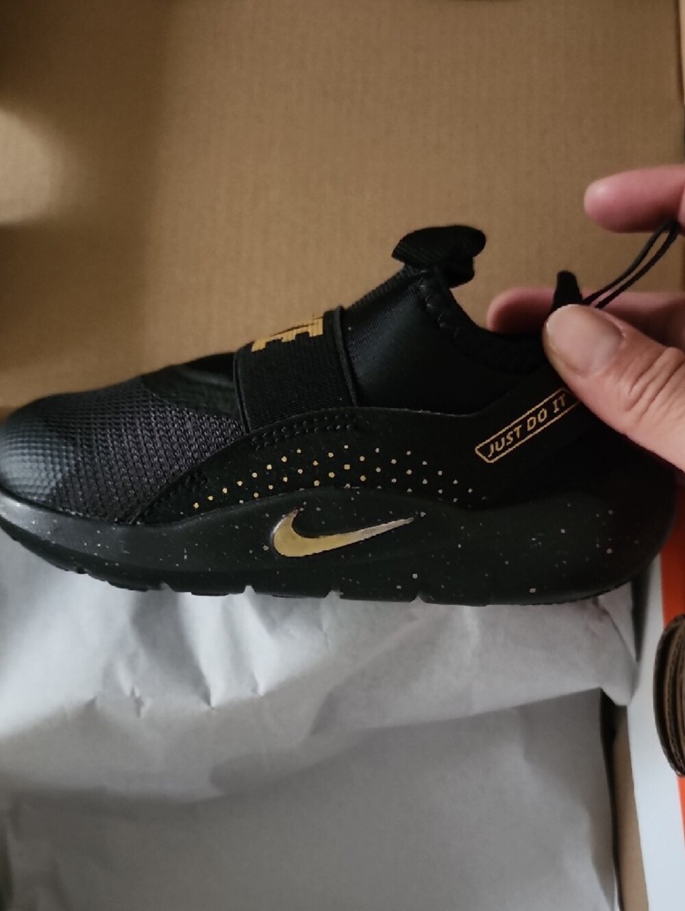 Nike Shoe Black and Metallic Gold